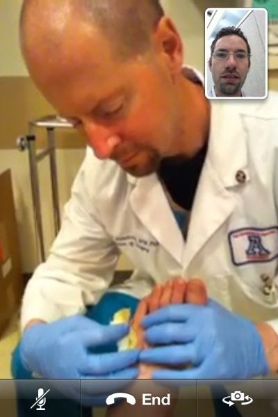 dr-david-armstrong-and-dr-lee-rogers-collaborating-over-facetime-on-apple-iphone-4