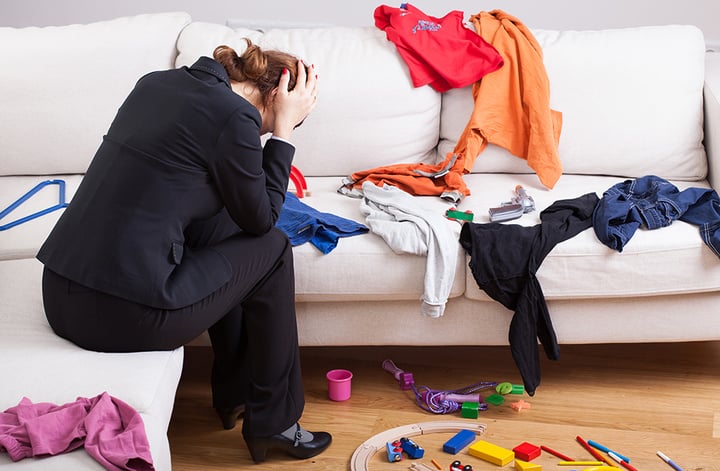 An unhappy woman sitting on a sofa in a messy living room; Shutterstock ID 176261732; user id: 13274325; user email: ken@ifanr.com; user_country: China; discount: 38%