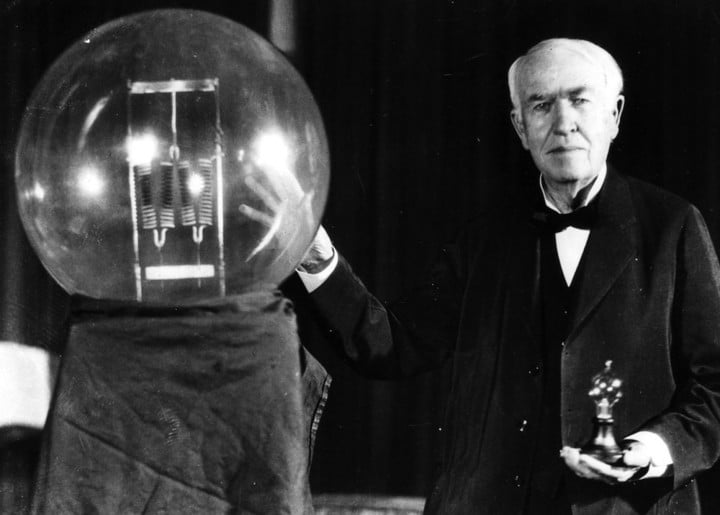 On December 31, 1879 Thomas A. Edison gave the first public demonstration of the incandescent lamp in Menlo Park. He is seen here in 1929 holding a replica of his first lamp, which had the power of 16 candles. In contrast, the lamp on the left had the power of 150,000 candles. (UPI Photo/Files)