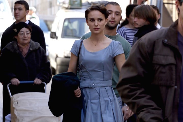 Oscar winning star Natalie Portman acts in a scene of a new film she is directing herself on February 13, 2014 in Jerusalem. Portman is in the city to work on a film adapted from Israeli novelist Amos Oz's acclaimed memoir "A Tale of Love and Darkness", which has been translated into 28 languages and has sold over a million copies worldwide. The film details Oz's childhood in Jerusalem in the chaotic period at the end of the British mandate in Palestine, as well as the writer's experiences during the early years following the establishment of the the state of Israel and his teenage in a kibbutz. Portman, who was born in Jerusalem to an Israeli father and an American mother, plays a supporting role as Oz's mother. AFP PHOTO/GALI TIBBON