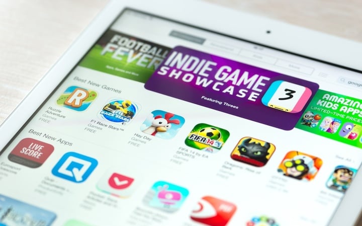 KIEV, UKRAINE - JUNE 05, 2014: Brand new modern white Apple iPad Air with featured mobile games apps in App Store collection. App Store is a digital distribution service for mobile apps on iOS platform, developed by Apple Inc. Apple iPad Air is developed by Apple inc. and was released on November 1, 2013.
