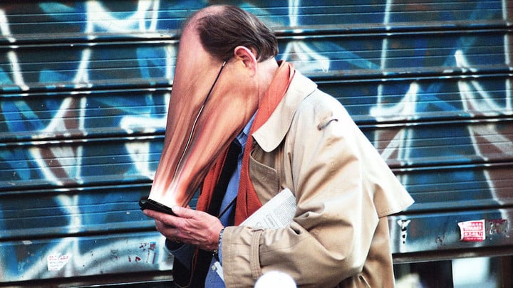 3053505-poster-p-1-eerie-photo-essay-shows-peoples-faces-getting-warped-by-their-devices