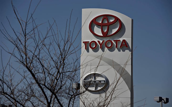 A sign stands outside Hiland Toyota dealership in Moline, Illinois, U.S., on Wednesday, April 9, 2014. Toyota Motor Corp., the world's largest carmaker, called back more than 6 million vehicles to fix a range of safety defects in one of the biggest recalls in automotive history. Photographer: Daniel Acker/Bloomberg