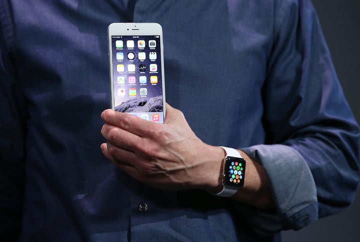 CUPERTINO, CA - SEPTEMBER 09: Apple CEO Tim Cook shows off the new iPhone 6 and the Apple Watch during an Apple special event at the Flint Center for the Performing Arts on September 9, 2014 in Cupertino, California. Apple is expected to unveil the new iPhone 6 and wearble tech. (Photo by Justin Sullivan/Getty Images)