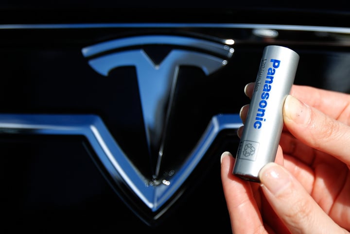 A Panasonic Corp's lithium-ion battery is pictured with Tesla Motors logo in Tokyo