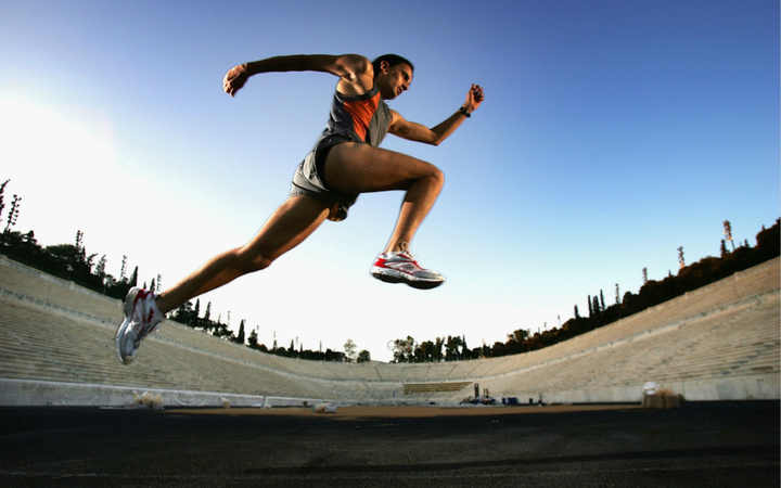 ATHENS, GREECE - JULY 20: Greek marathon runner Vasileios Zambelis runs through the Panathinaikon Stadium July 20, 2004 in Athens. The 2004 summer Olympics will take place in Athens in August. (Photo by Ian Waldie/Getty Images) *** Local Caption *** Vasileios Zambelis