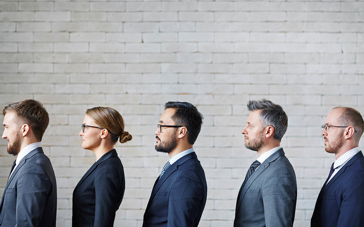 Business people standing in a row