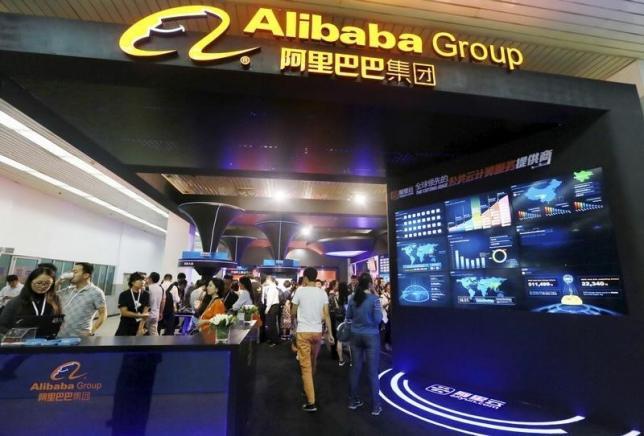 People visit the booth of Alibaba Group during an exhibition in Beijing, China, September 22, 2015. REUTERS/Stringer