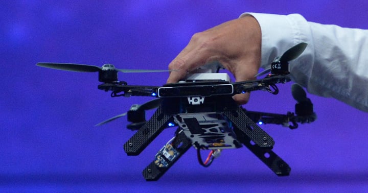 Intel CEO Brian Krzanich displays the Aero Ready To Fly drone -- a fully-assembled quadcopter with compute board, integrated depth and vision capabilities using Intel RealSense Technology. Krzanich displayed the new quadcopter during his keynote at the 2016 Intel Developer Forum in San Francisco on Tuesday, Aug. 16, 2016. (Credit: Intel Corporation)