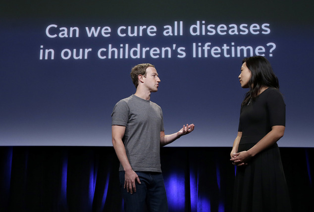 In this Tuesday, Sept. 20, 2016, photo, Facebook CEO Mark Zuckerberg, left, speaks with his wife, Priscilla Chan, as they rehearse for a speech in San Francisco. Zuckerberg and Chan have a new lofty goal: to cure, manage or eradicate all disease by the end of this century. To this end, the Chan Zuckerberg Initiative, the couple's philanthropic organization, is committing significant financial resources over the next decade to help accelerate basic science research. (AP Photo/Jeff Chiu)