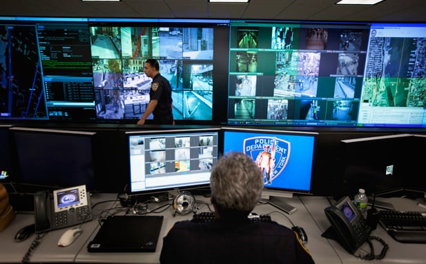 THIS PICTURE IS 5 of 45 TO ACCOMPANY THE PICTURE PACKAGE - NYPD A DECADE LATER. THE SERIES HIGHLIGHTS THE HEIGHTENED POLICE PRESENCE IN THE CITY. SEARCH KEYWORD "NYPD" TO SEE ALL THE IMAGES. A New York Police Department officer watches video feeds in the Lower Manhattan Security Initiative facility in New York September 1, 2011.The NYPD has worked since 9/11 on a long-term project to permanently increase vigilance in Lower Manhattan and Midtown, home to prominent financial institutions and national landmarks. Picture taken September 1, 2011. REUTERS/Lucas Jackson (UNITED STATES - Tags: CRIME LAW) - RTR2QY1A