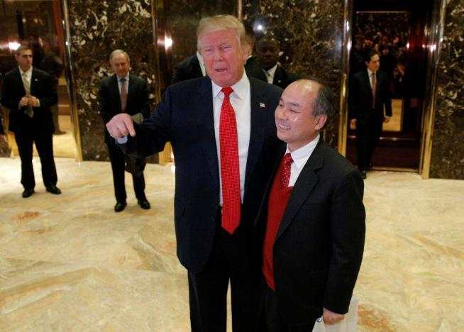 U.S. President-elect Donald Trump and Softbank CEO Masayoshi Son speak to the press after meeting at Trump Tower in Manhattan, New York City, U.S., December 6, 2016. REUTERS/Brendan McDermid