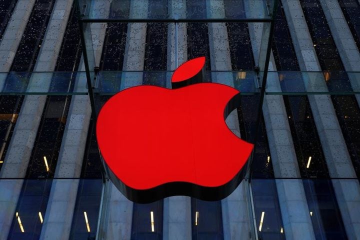 An Apple logo hangs above the entrance to the Apple store on 5th Avenue in the Manhattan borough of New York City, U.S., December 5, 2016. REUTERS/Brendan McDermid