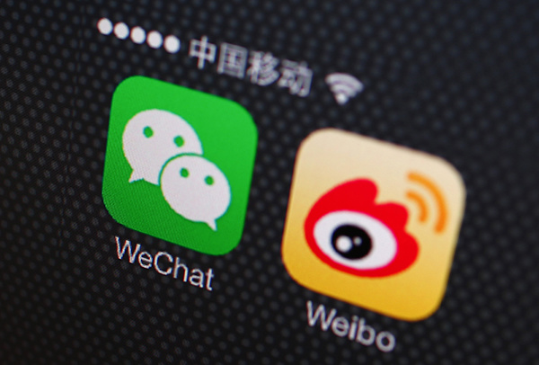 A picture illustration shows icons of WeChat and Weibo app in Beijing, December 5, 2013. An unprecedented Nov. 14 leak of China's Communist Party reform plans fuelled China's biggest stock market rally in two months as it spread on microblogs and passed from smartphone to smartphone on WeChat, a three-year-old social messaging app developed by Tencent Holdings Ltd. WeChat, or Weixin in Chinese, meaning "micromessage", leapt from 121 million global monthly active users at the end of September 2012 to 272 million in just a year. It has quickly become the news source of choice for savvy mobile users in China, where a small army of censors scrub the country's Internet of politically sensitive news and "harmful" speech. Unlike popular microblogging services such as Sina Corp's Sina Weibo, where messages can reach millions of people in minutes, WeChat allows users to communicate in small, private circles of friends, and send text and voice messages for free - a big part of its success. Weibo has been particularly singled-out in the ongoing crackdown on "rumour-mongering" by China's stability-obsessed government, which views public protest as a threat to its authority. But WeChat has not escaped the government's attention, and its explosive growth means it is attracting more scrutiny than ever from the authorities. The Chinese characters above reads "China Mobile". Picture taken December 5, 2013. REUTERS/Petar Kujundzic (CHINA - Tags: POLITICS BUSINESS TELECOMS) - RTX16EHL