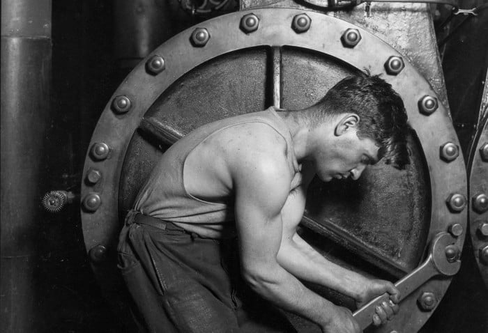 lewis_hine_power_house_mechanic_working_on_steam_pump-e13637711392901