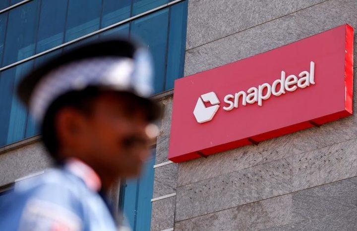 A private security gurad stands at a gate of Snapdeal headquarters in Gurugram